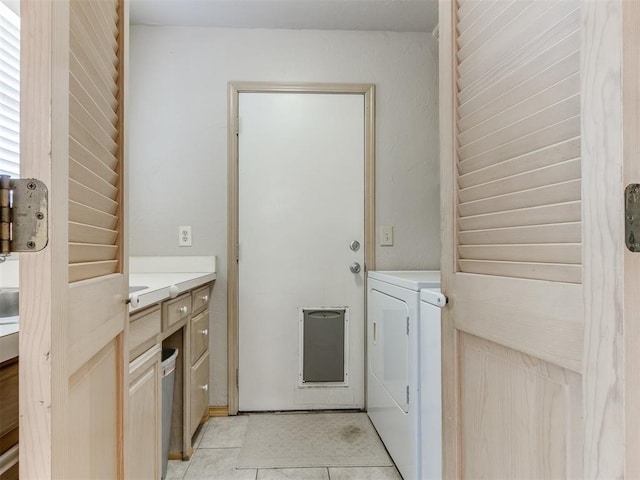 1312 Every Dr, Edmond, OK 73034 - washroom with washing machine and clothes dryer and light tile patterned flooring