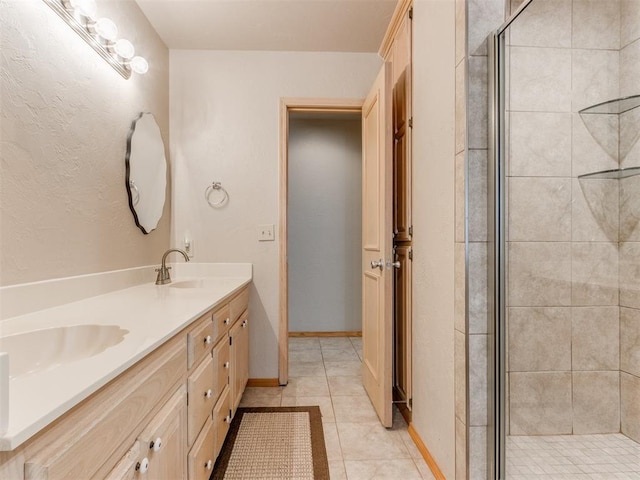 1312 Every Dr, Edmond, OK 73034 - full bath featuring double vanity, a shower stall, and tile patterned floors