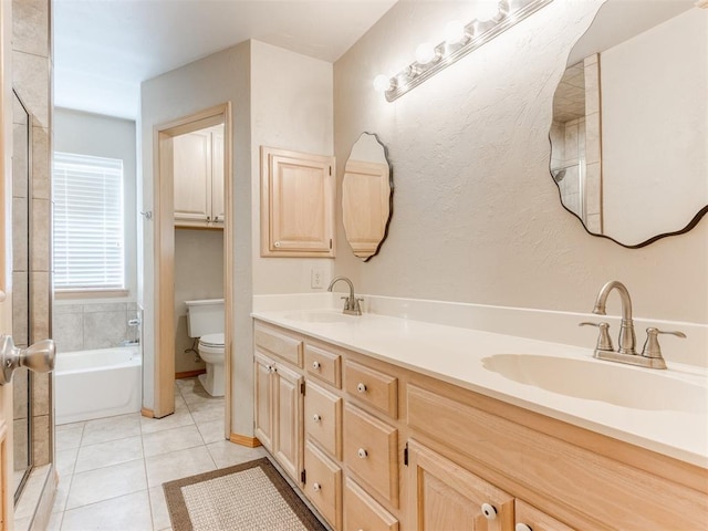 1312 Every Dr, Edmond, OK 73034 - full bathroom with toilet, a tub to relax in, double vanity, tile patterned floors, and a shower