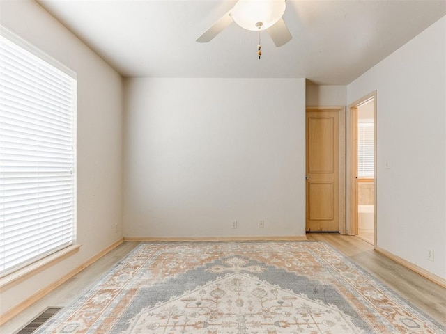 1312 Every Dr, Edmond, OK 73034 - unfurnished room featuring light wood-type flooring, baseboards, and a ceiling fan