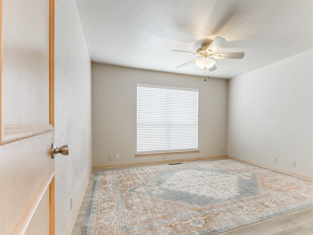 1312 Every Dr, Edmond, OK 73034 - empty room with a ceiling fan and baseboards