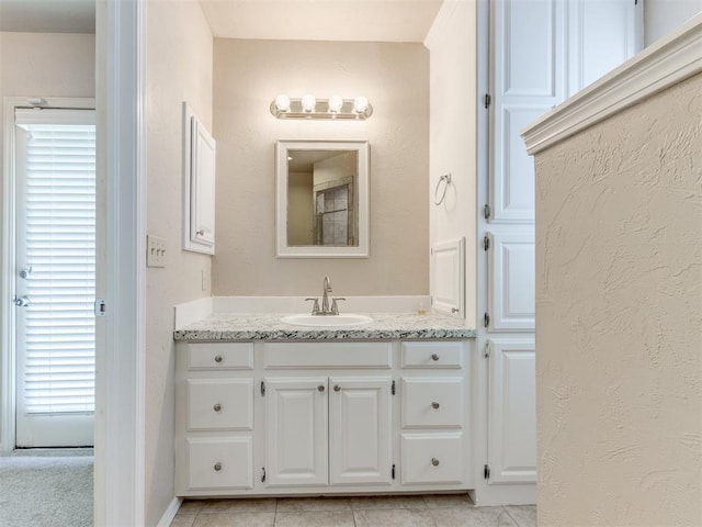 1312 Every Dr, Edmond, OK 73034 - bathroom with vanity and tile patterned floors