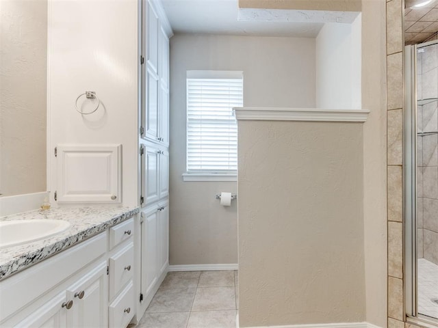 1312 Every Dr, Edmond, OK 73034 - full bathroom with a shower stall, vanity, and tile patterned flooring