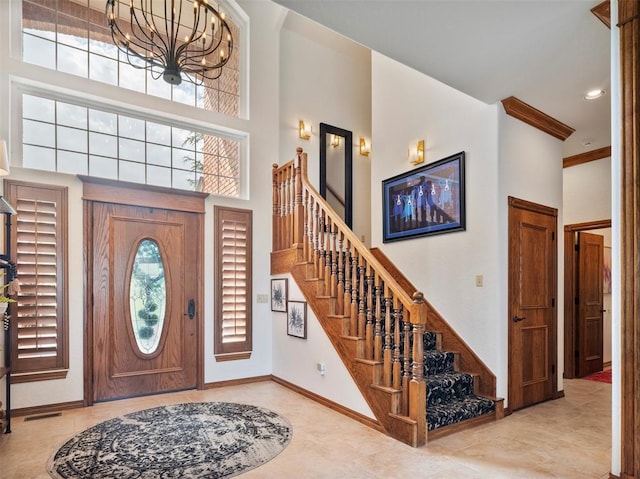 205 W Waterfront Dr, Tuttle, OK 73089 - tiled entrance foyer with stairs, baseboards, a chandelier, a towering ceiling, and recessed lighting