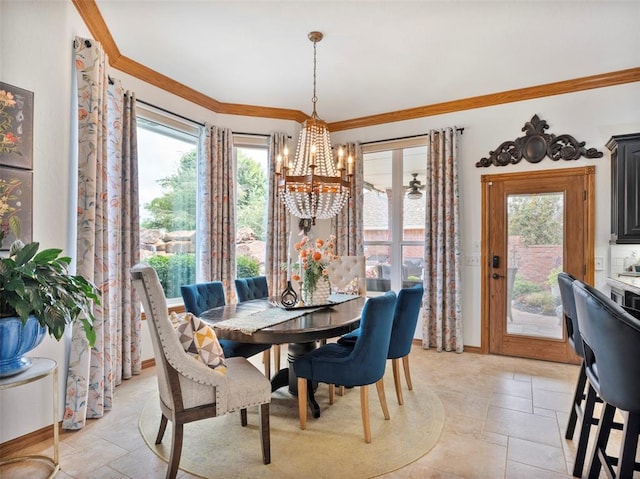 205 W Waterfront Dr, Tuttle, OK 73089 - dining area with a chandelier, plenty of natural light, stone tile flooring, ornamental molding, and baseboards