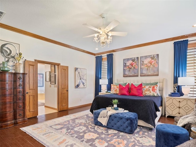 205 W Waterfront Dr, Tuttle, OK 73089 - bedroom with wood finished floors, crown molding, a ceiling fan, baseboards, and ensuite bathroom