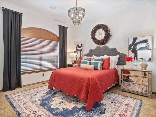 205 W Waterfront Dr, Tuttle, OK 73089 - bedroom featuring carpet floors, a chandelier, and baseboards