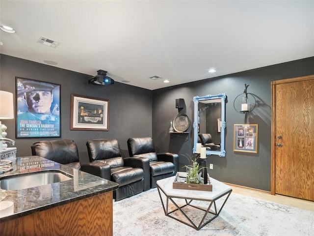 205 W Waterfront Dr, Tuttle, OK 73089 - home theater room with a sink, recessed lighting, and light wood-type flooring