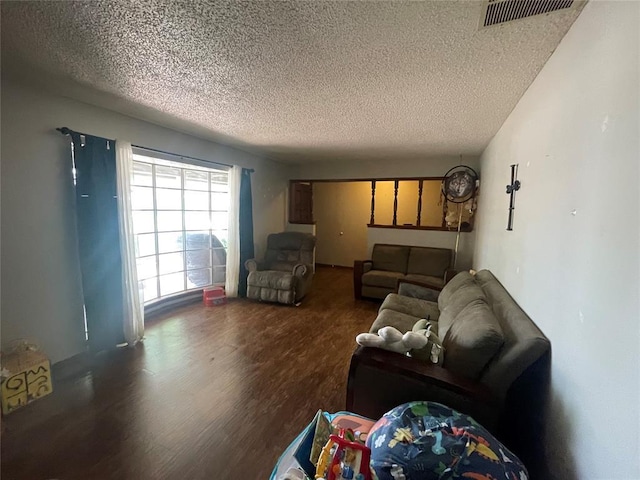 139 Sheridan Pl, Chickasha, OK 73018 - living room featuring a textured ceiling and wood finished floors