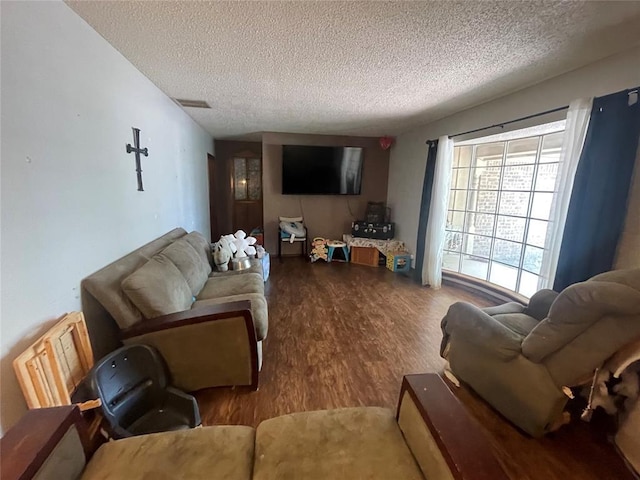 139 Sheridan Pl, Chickasha, OK 73018 - living area with a textured ceiling and wood finished floors