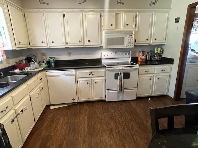 139 Sheridan Pl, Chickasha, OK 73018 - kitchen featuring white appliances, dark wood-type flooring, dark countertops, and a sink