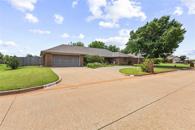 1205 Francis Ln, Kingfisher, OK 73750 - view of front of house featuring driveway, brick siding, and an attached garage