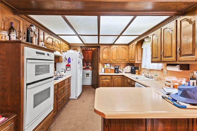 1205 Francis Ln, Kingfisher, OK 73750 - kitchen with a sink, white appliances, light colored carpet, light countertops, and under cabinet range hood