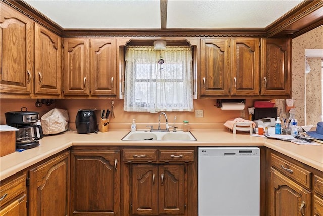 1205 Francis Ln, Kingfisher, OK 73750 - kitchen with white dishwasher, a sink, light countertops, brown cabinets, and wallpapered walls