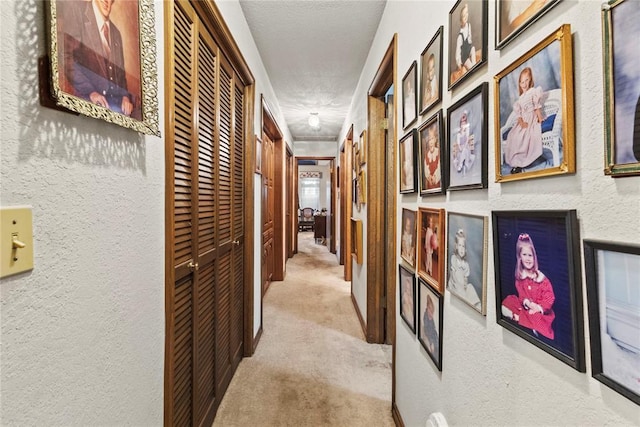 1205 Francis Ln, Kingfisher, OK 73750 - hall featuring carpet floors, a textured wall, and a textured ceiling