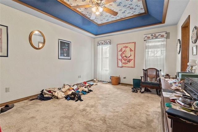 1205 Francis Ln, Kingfisher, OK 73750 - recreation room featuring a tray ceiling, carpet flooring, a ceiling fan, and baseboards