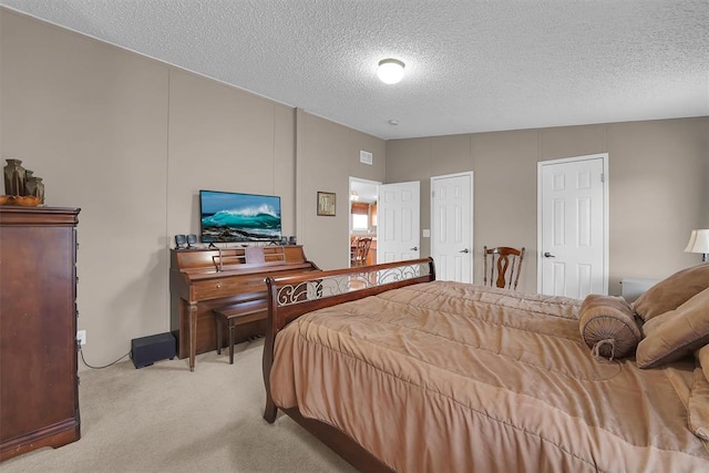 1318 N Cook St, Cordell, OK 73632 - bedroom with carpet floors and a textured ceiling