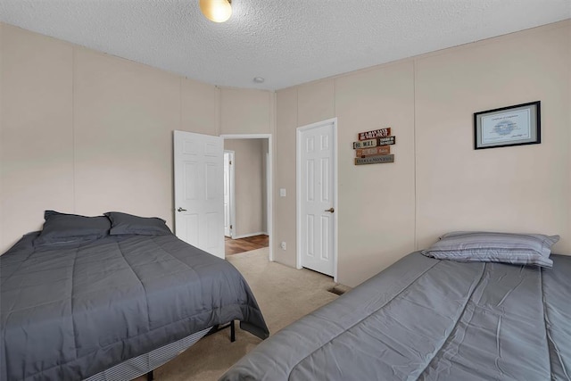 1318 N Cook St, Cordell, OK 73632 - bedroom featuring carpet flooring and a textured ceiling