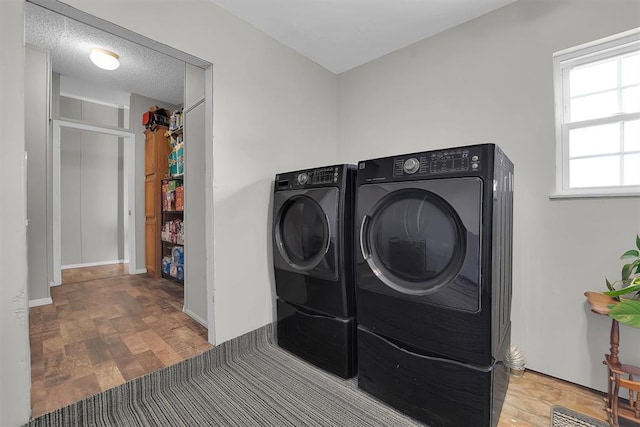 1318 N Cook St, Cordell, OK 73632 - laundry area with separate washer and dryer and baseboards