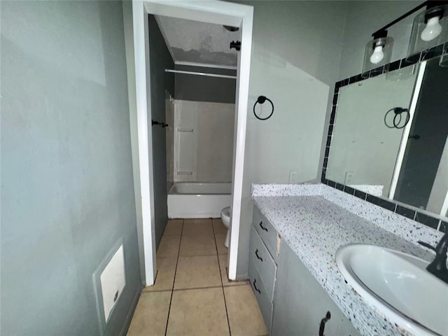 1502 S 12th St, Chickasha, OK 73018 - full bath featuring toilet, vanity, tile patterned floors, and shower / tub combination