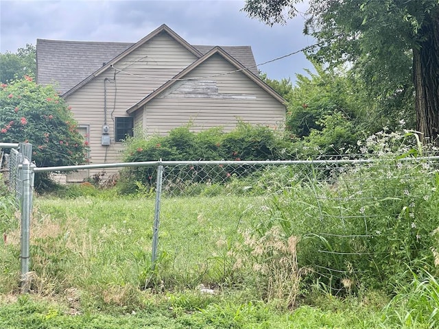 1502 S 12th St, Chickasha, OK 73018 - view of property exterior with a shingled roof