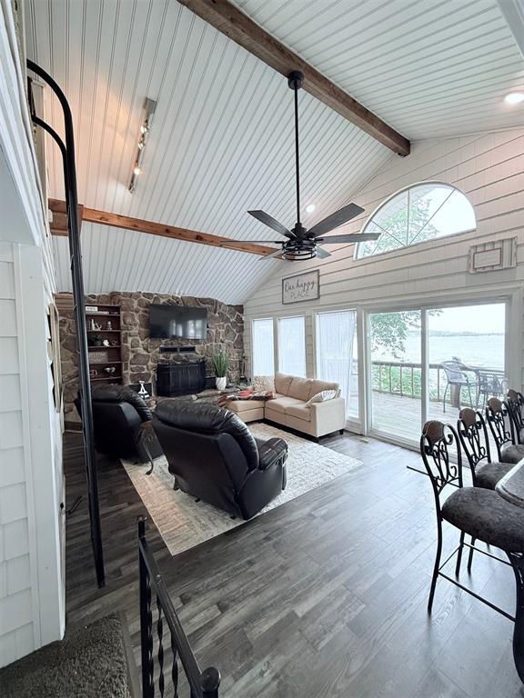926 Park Cove Ln, Eucha, OK 74342 - living area featuring a ceiling fan, wood finished floors, and wood walls