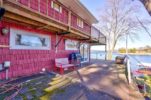 926 Park Cove Ln, Eucha, OK 74342 - view of patio with a grill and a water view