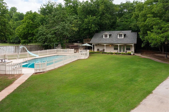 1736 Bryant Cir, Norman, OK 73026 - view of pool with a water slide, an outbuilding, a patio, and a storage structure