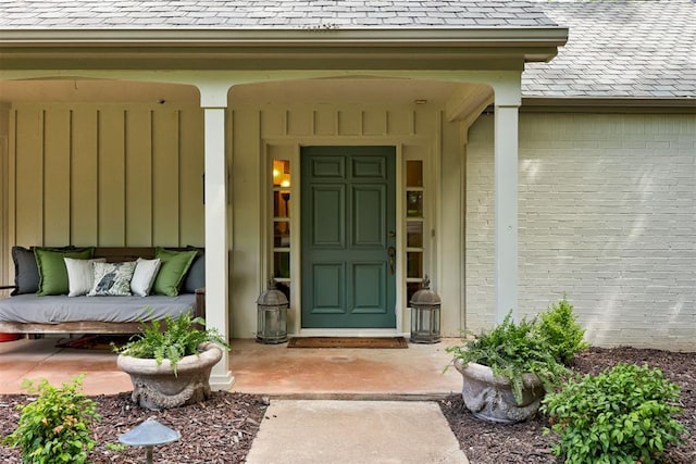 1736 Bryant Cir, Norman, OK 73026 - property entrance with roof with shingles and brick siding