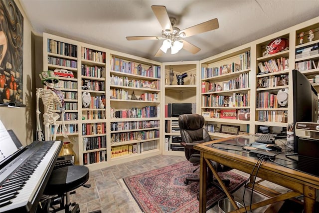 1736 Bryant Cir, Norman, OK 73026 - office with bookshelves, a ceiling fan, built in features, and stone tile floors