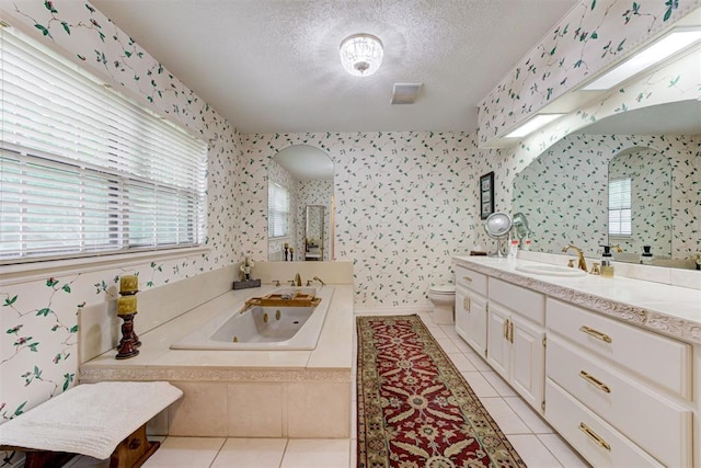 1736 Bryant Cir, Norman, OK 73026 - full bathroom featuring wallpapered walls, tile patterned floors, a tub with jets, a textured ceiling, and toilet