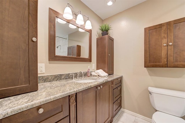 1736 Bryant Cir, Norman, OK 73026 - bathroom featuring vanity, toilet, tile patterned floors, and baseboards