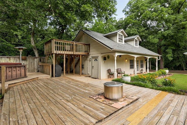 1736 Bryant Cir, Norman, OK 73026 - wooden deck with stairs, a fire pit, and view of scattered trees