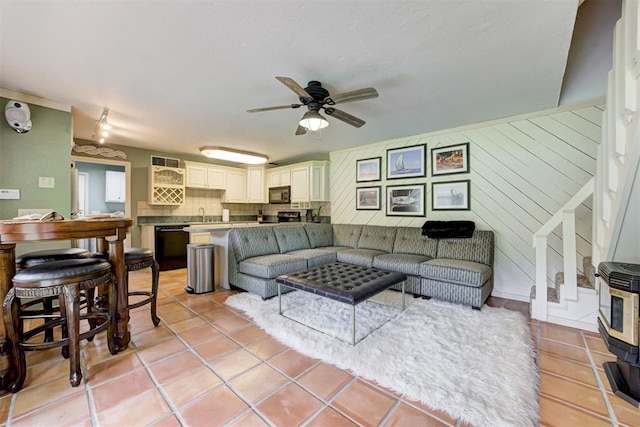 1736 Bryant Cir, Norman, OK 73026 - living room with a ceiling fan and light tile patterned floors