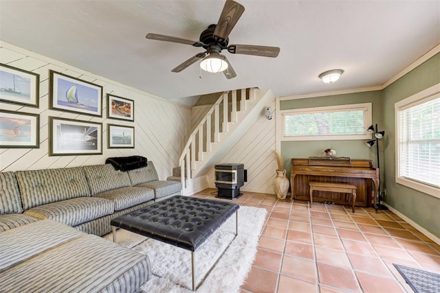 1736 Bryant Cir, Norman, OK 73026 - living area featuring stairs, baseboards, light tile patterned flooring, a ceiling fan, and wooden walls