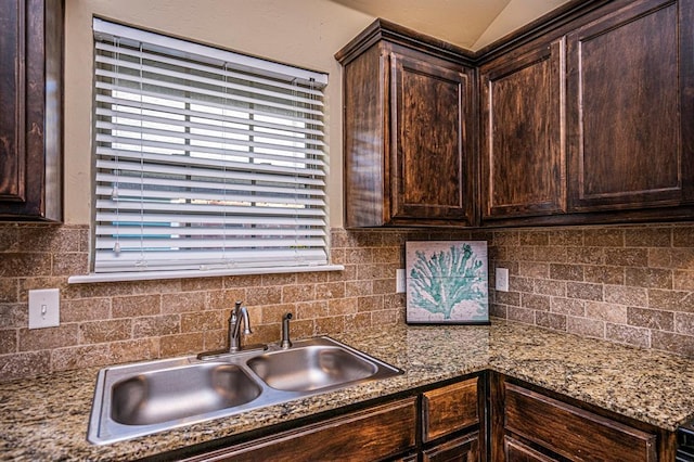 12604 William Penn Blvd, Oklahoma City, OK 73103 - kitchen featuring dark brown cabinetry, decorative backsplash, and healthy amount of natural light