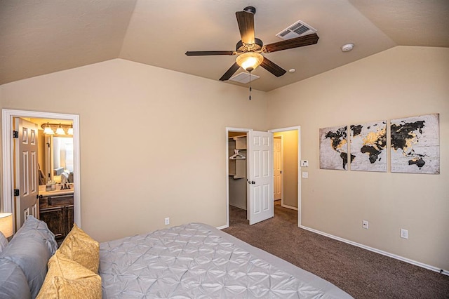 12604 William Penn Blvd, Oklahoma City, OK 73103 - bedroom featuring vaulted ceiling, carpet flooring, a spacious closet, ceiling fan, and connected bathroom