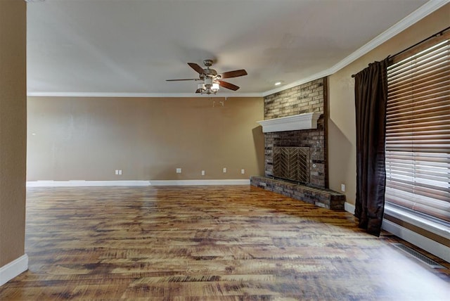 846 Two Forty Pl, Oklahoma City, OK 73139 - unfurnished living room with ceiling fan, ornamental molding, a fireplace, and wood finished floors