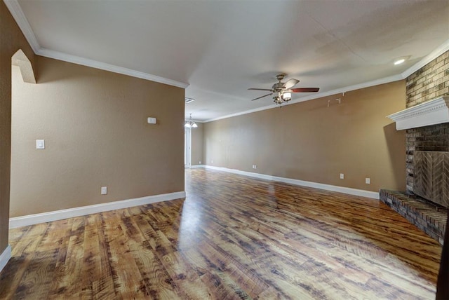 846 Two Forty Pl, Oklahoma City, OK 73139 - unfurnished living room featuring a fireplace, ceiling fan, ornamental molding, and wood finished floors