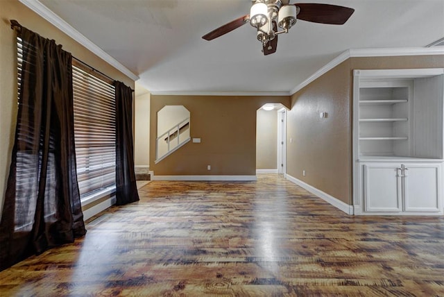 846 Two Forty Pl, Oklahoma City, OK 73139 - unfurnished room with a ceiling fan, built in features, crown molding, arched walkways, and wood finished floors