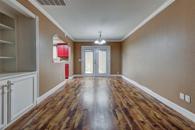 846 Two Forty Pl, Oklahoma City, OK 73139 - foyer entrance featuring a chandelier, dark wood finished floors, and crown molding