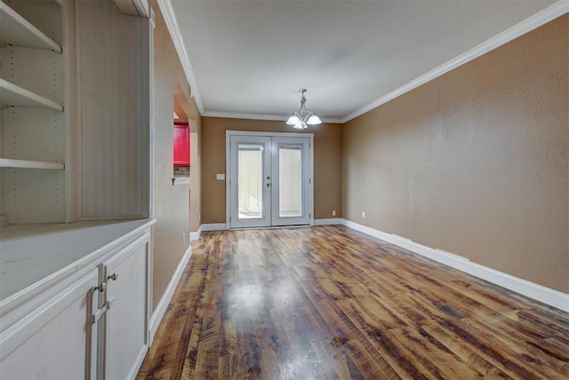 846 Two Forty Pl, Oklahoma City, OK 73139 - unfurnished dining area featuring crown molding, wood finished floors, a chandelier, and french doors