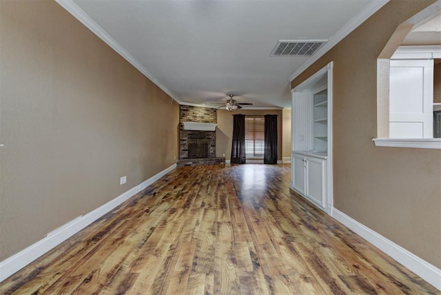 846 Two Forty Pl, Oklahoma City, OK 73139 - unfurnished living room featuring a brick fireplace, ceiling fan, wood finished floors, and ornamental molding