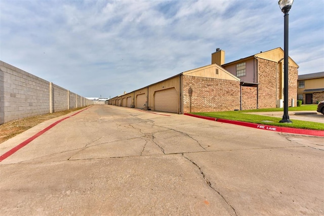 846 Two Forty Pl, Oklahoma City, OK 73139 - view of concrete road with street lighting and curbs