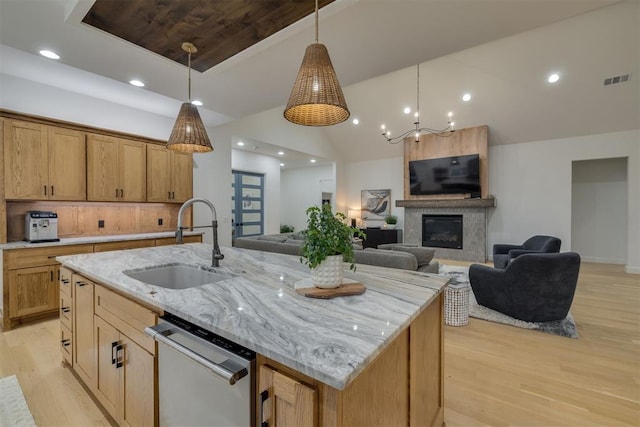 6524 NE 96th Cir, Oklahoma City, OK 73151 - kitchen featuring stainless steel dishwasher, light wood-style flooring, pendant lighting, light stone counters, and recessed lighting