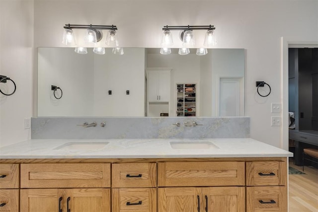 6524 NE 96th Cir, Oklahoma City, OK 73151 - bathroom featuring double vanity and wood finished floors