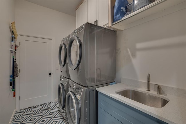 6524 NE 96th Cir, Oklahoma City, OK 73151 - laundry area with stacked washing machine and dryer and cabinet space