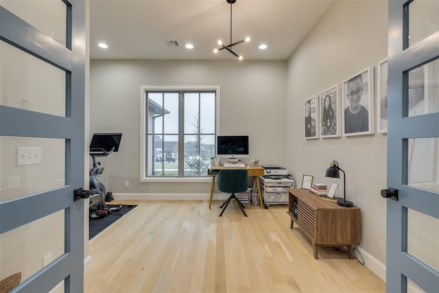 6524 NE 96th Cir, Oklahoma City, OK 73151 - office space featuring wood finished floors, recessed lighting, and a chandelier