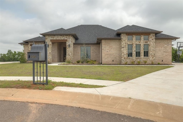 6524 NE 96th Cir, Oklahoma City, OK 73151 - view of front facade with a front lawn, brick siding, and roof with shingles