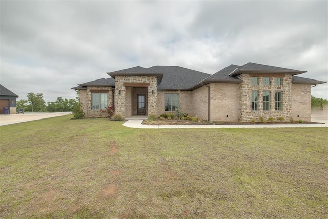 6524 NE 96th Cir, Oklahoma City, OK 73151 - view of front of house featuring a front lawn, brick siding, and a shingled roof